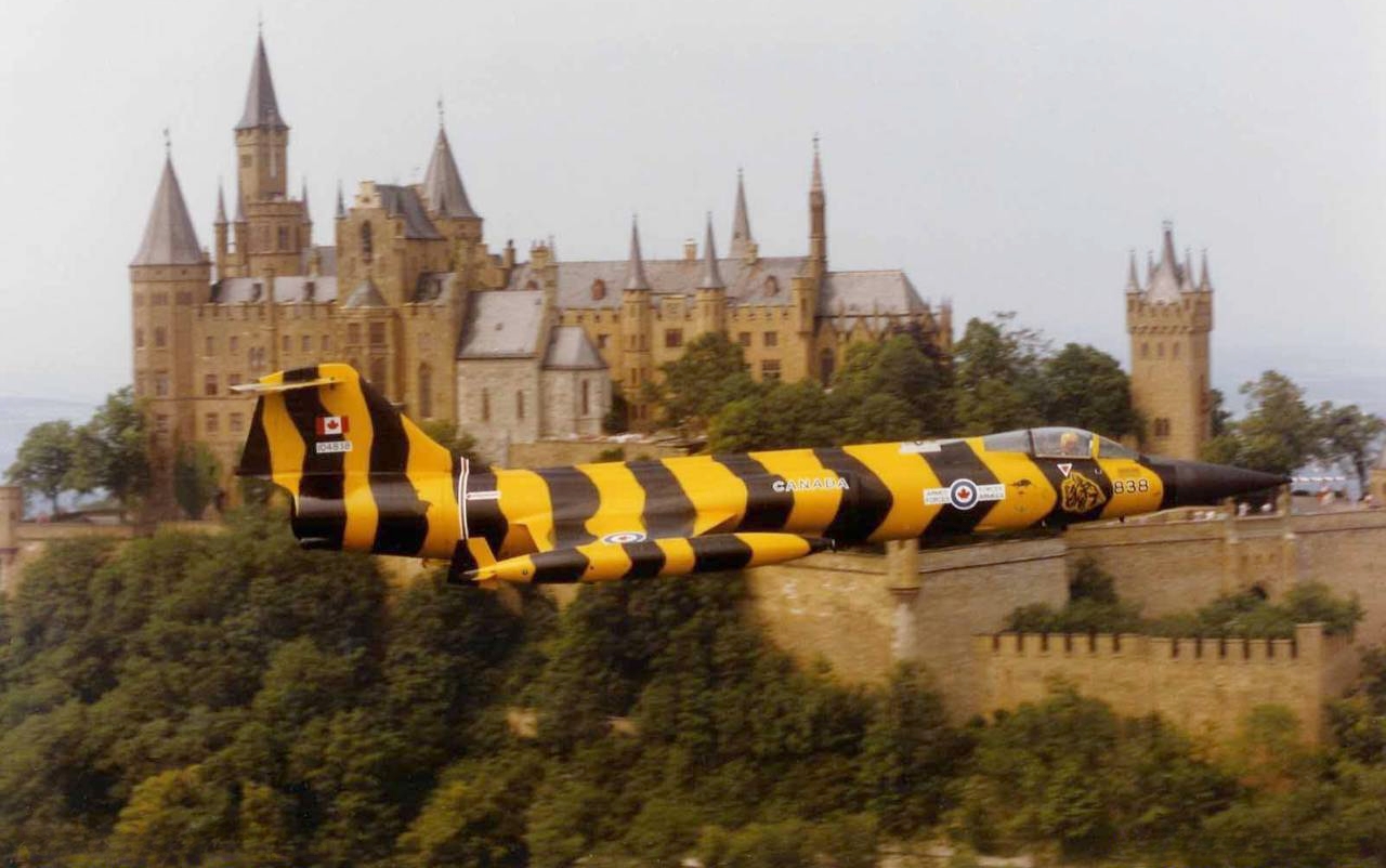 Canadian Armed Forces CF-104 Tigerbird flies by Schloss Hohenzollern castle in West Germany